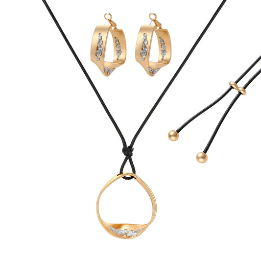 Gold circular pendant necklace with crystals on black cord paired with matching geometric hoop earrings on white background.