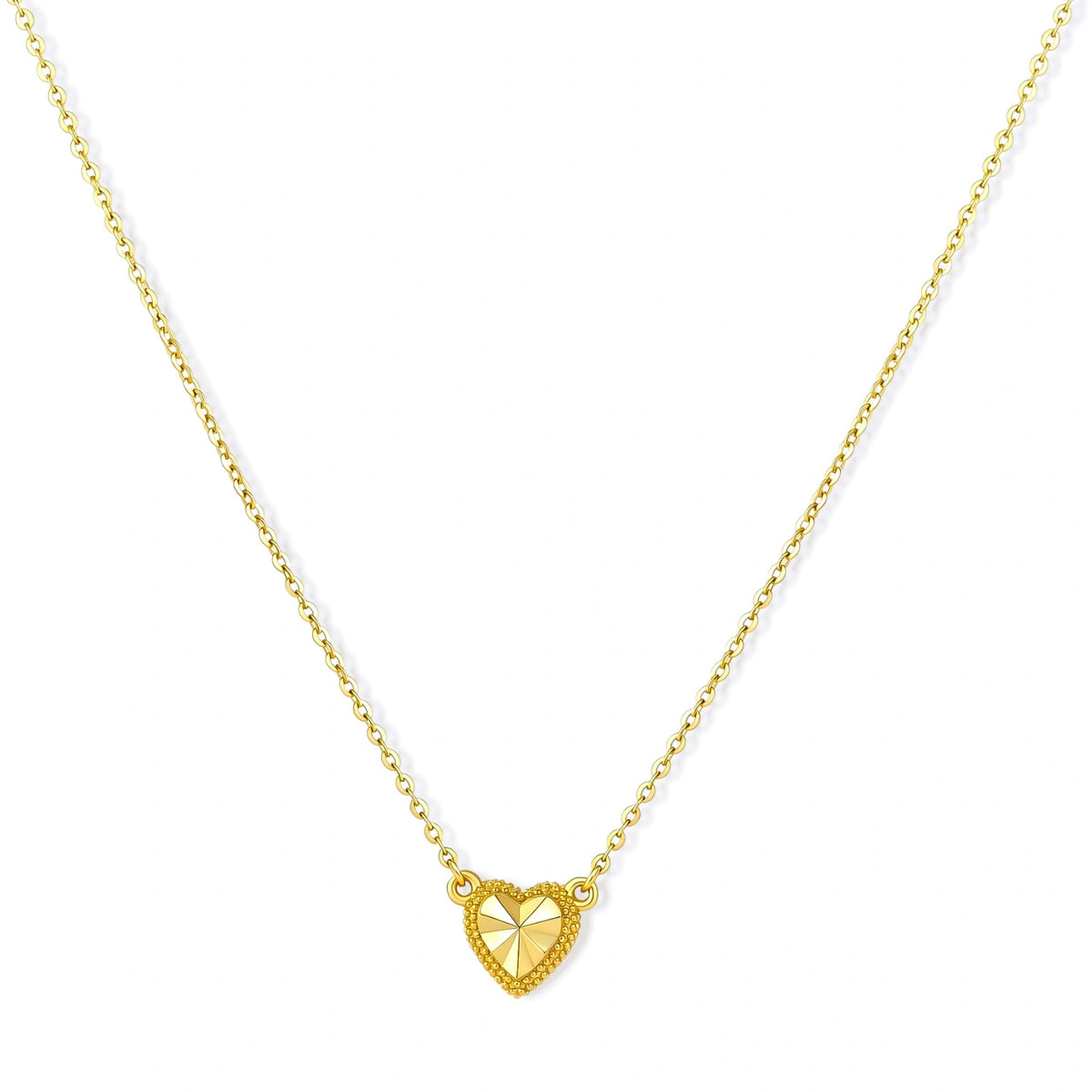Dainty 14K gold-plated 925 sterling silver necklace with a small beaded-edge heart pendant and sunburst facets on a cream background.