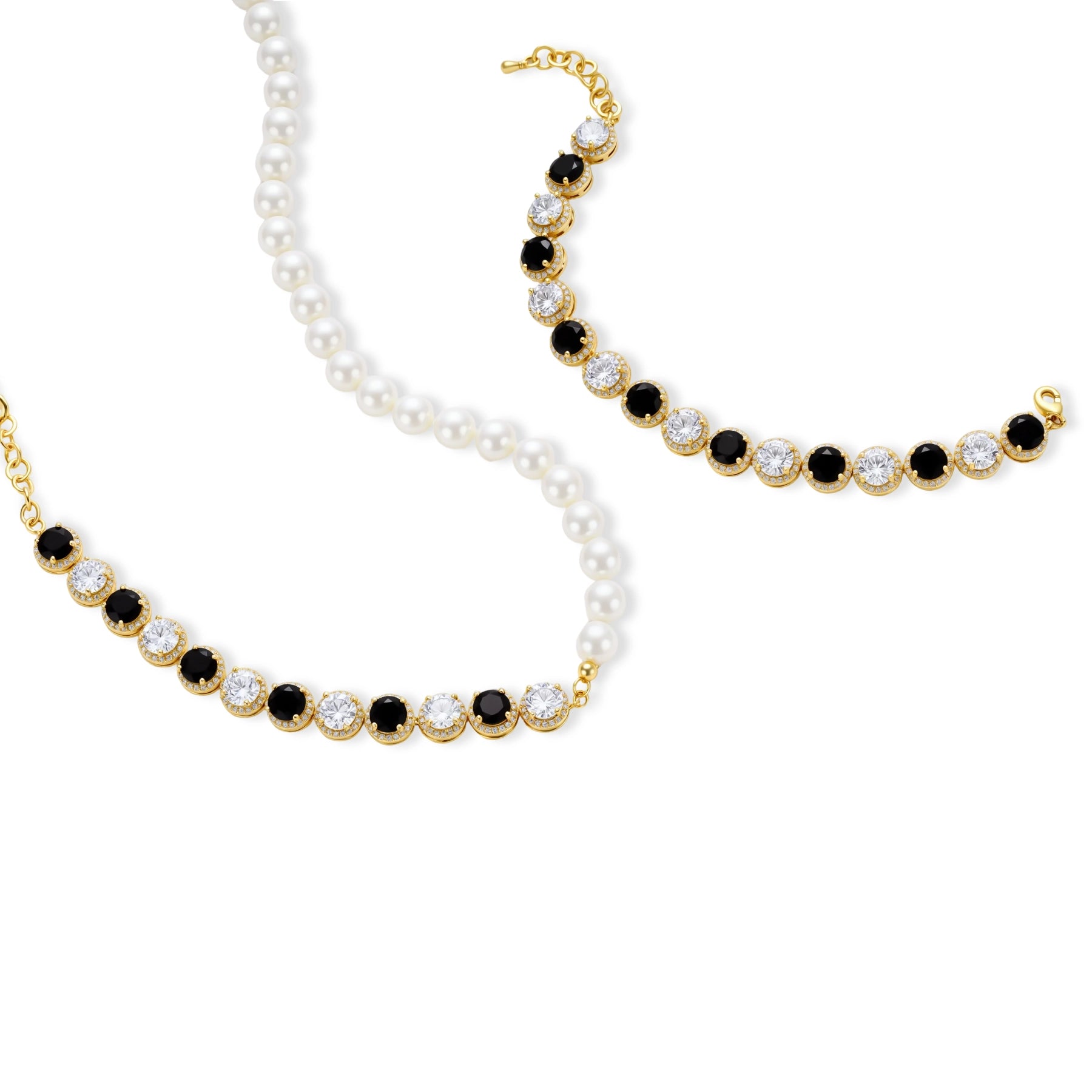 Gold-plated jewelry set with alternating black and clear cubic zirconia stones, featuring necklace, earrings and bracelet