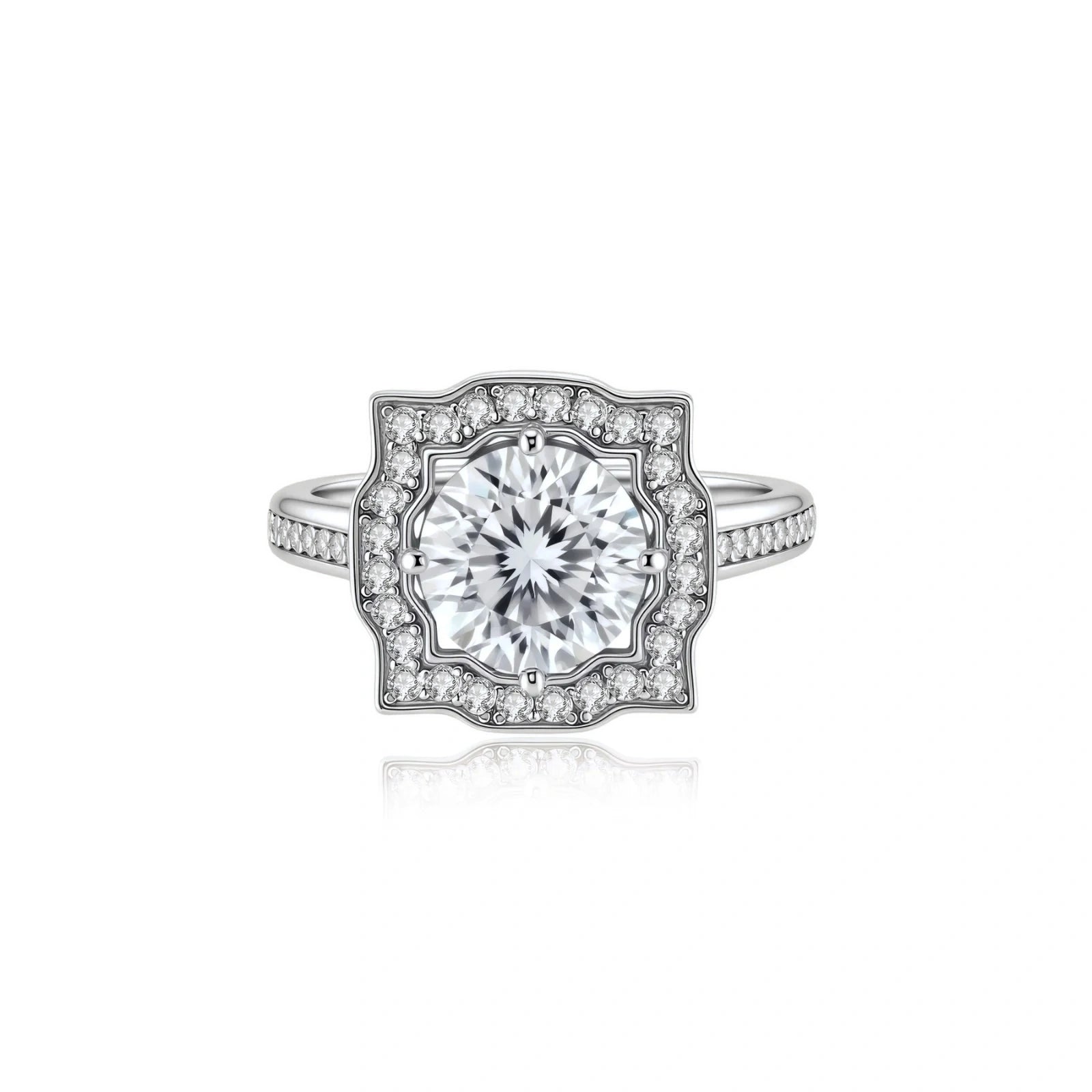 Sterling silver ring with round moissanite center stone in ornate scalloped halo setting on white background.