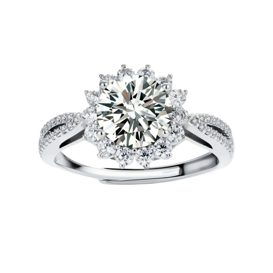 Close-up of sterling silver halo ring with brilliant round moissanite center stone surrounded by smaller accent stones