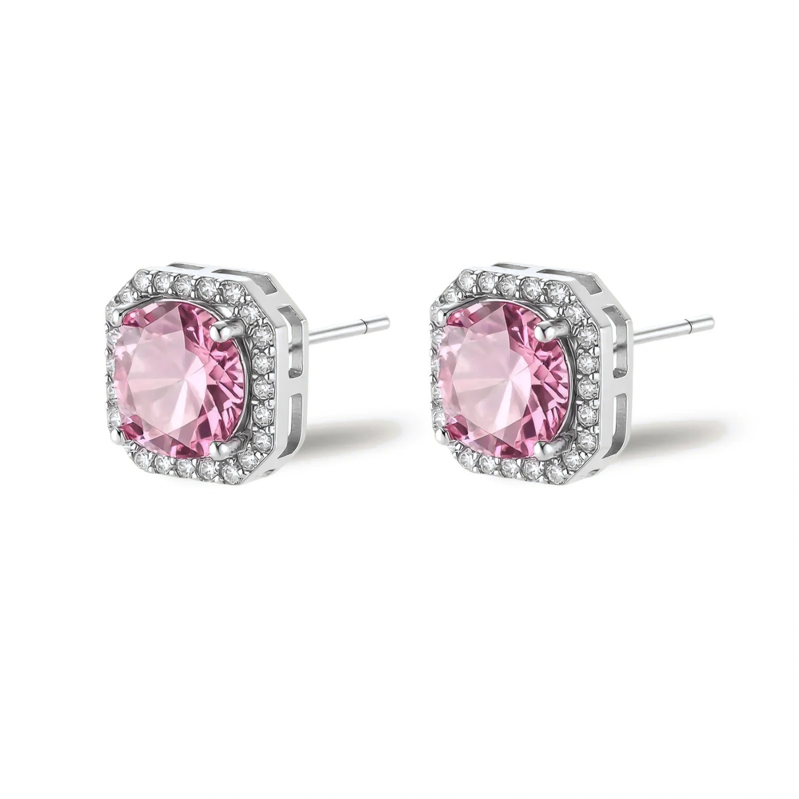Pink moissanite studs in octagonal sterling silver halo settings with sparkling accent stones on cream background.