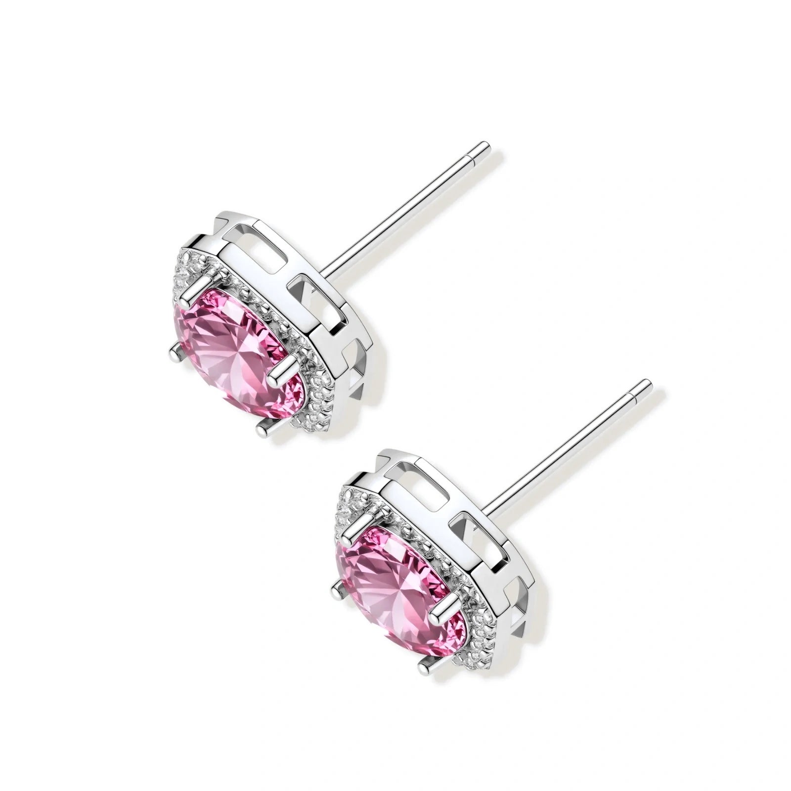 Pink moissanite studs in octagonal sterling silver halo settings with sparkling accent stones on cream background.