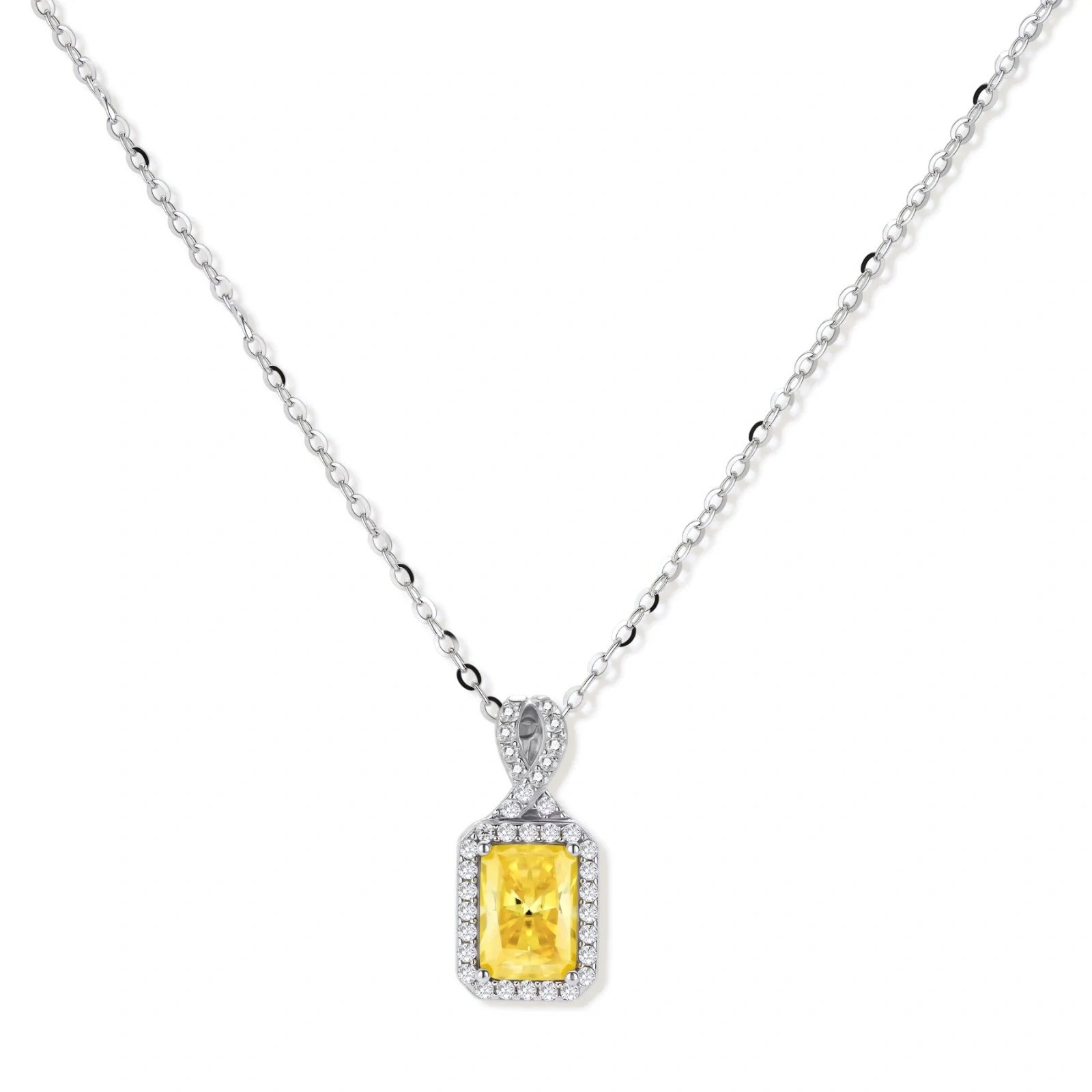 Rectangular yellow moissanite pendant in sterling silver halo setting on delicate chain against cream background.