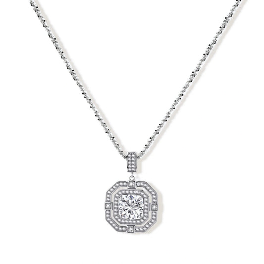 Sterling silver octagonal pendant necklace with brilliant moissanite center stone and halo setting on white background.
