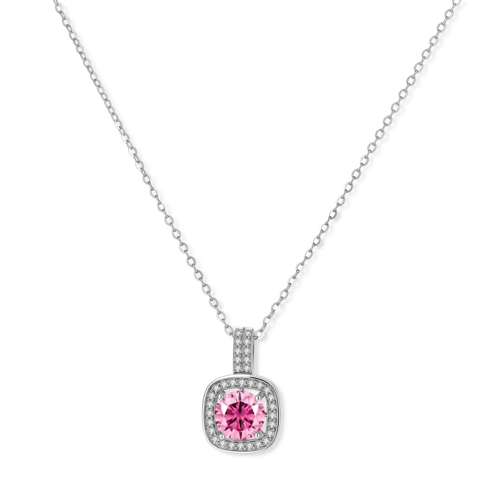 Sterling silver jewelry set featuring pink moissanite stones in halo settings on white background.