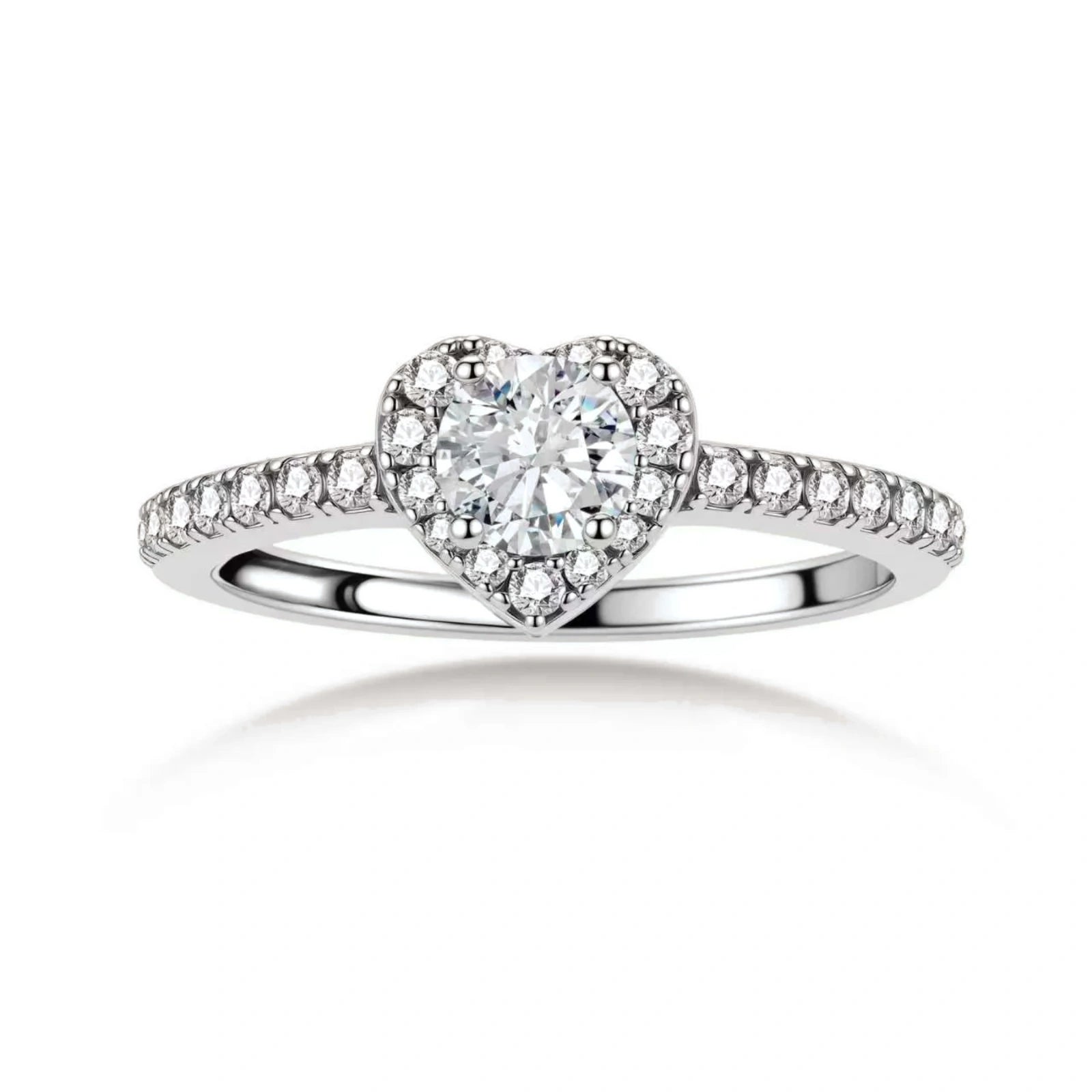 Heart-shaped halo ring with brilliant moissanite center stone surrounded by smaller crystals in sterling silver setting