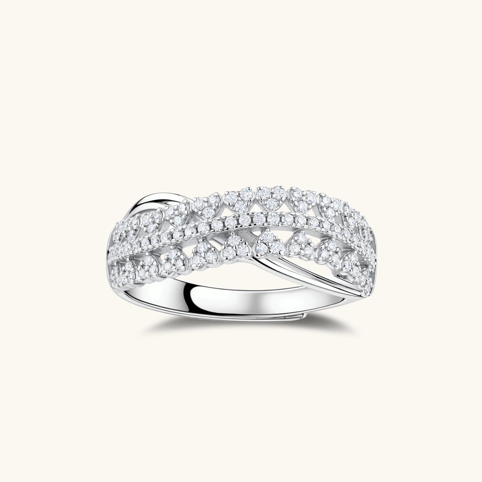 Sterling silver over ring with pavé-set moissanite stones creating an elegant infinity design on neutral background