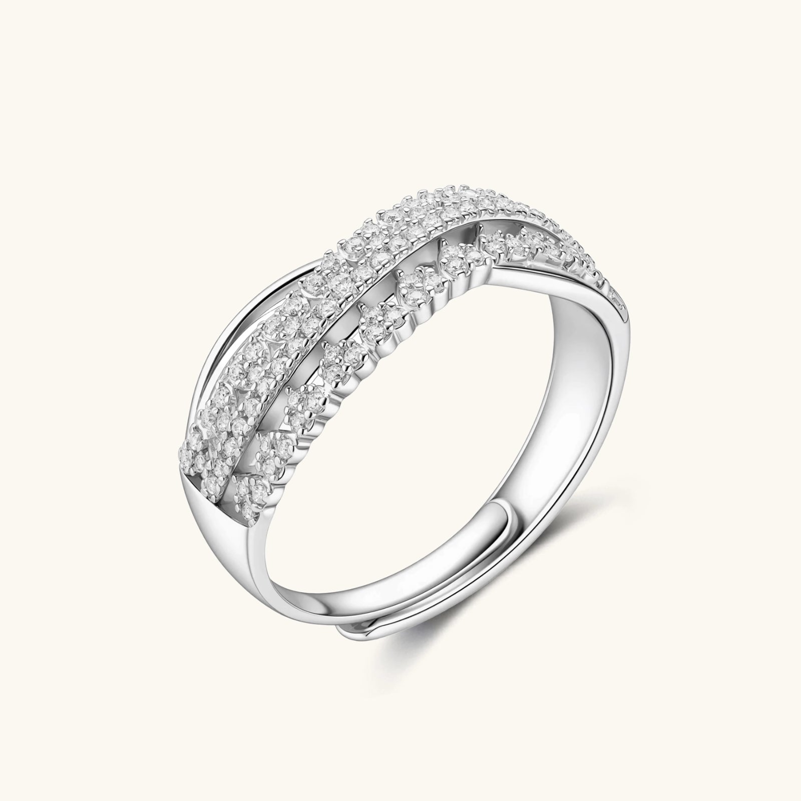 Sterling silver over ring with pavé-set moissanite stones creating an elegant infinity design on neutral background