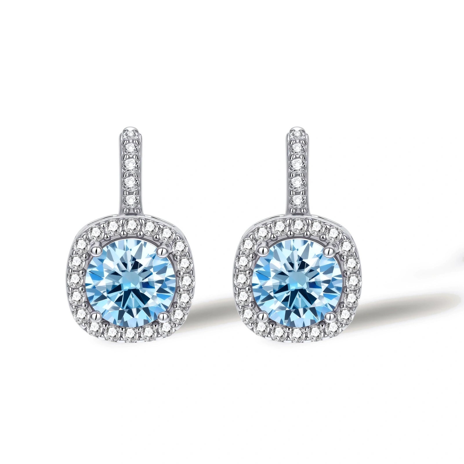 Sterling silver drop earrings featuring cushion-cut blue moissanite stones surrounded by sparkling halo settings