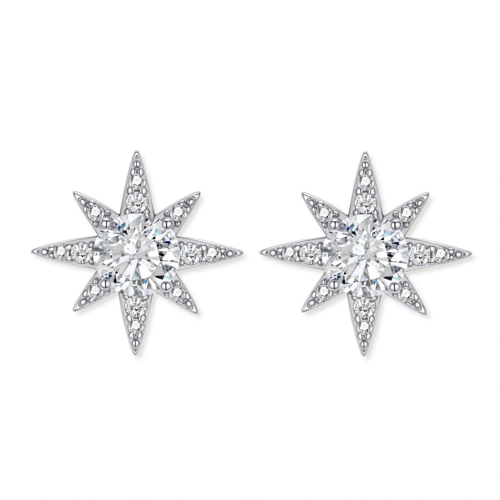 Sterling silver star-shaped stud earrings with brilliant moissanite center stones and pavé details on neutral background.