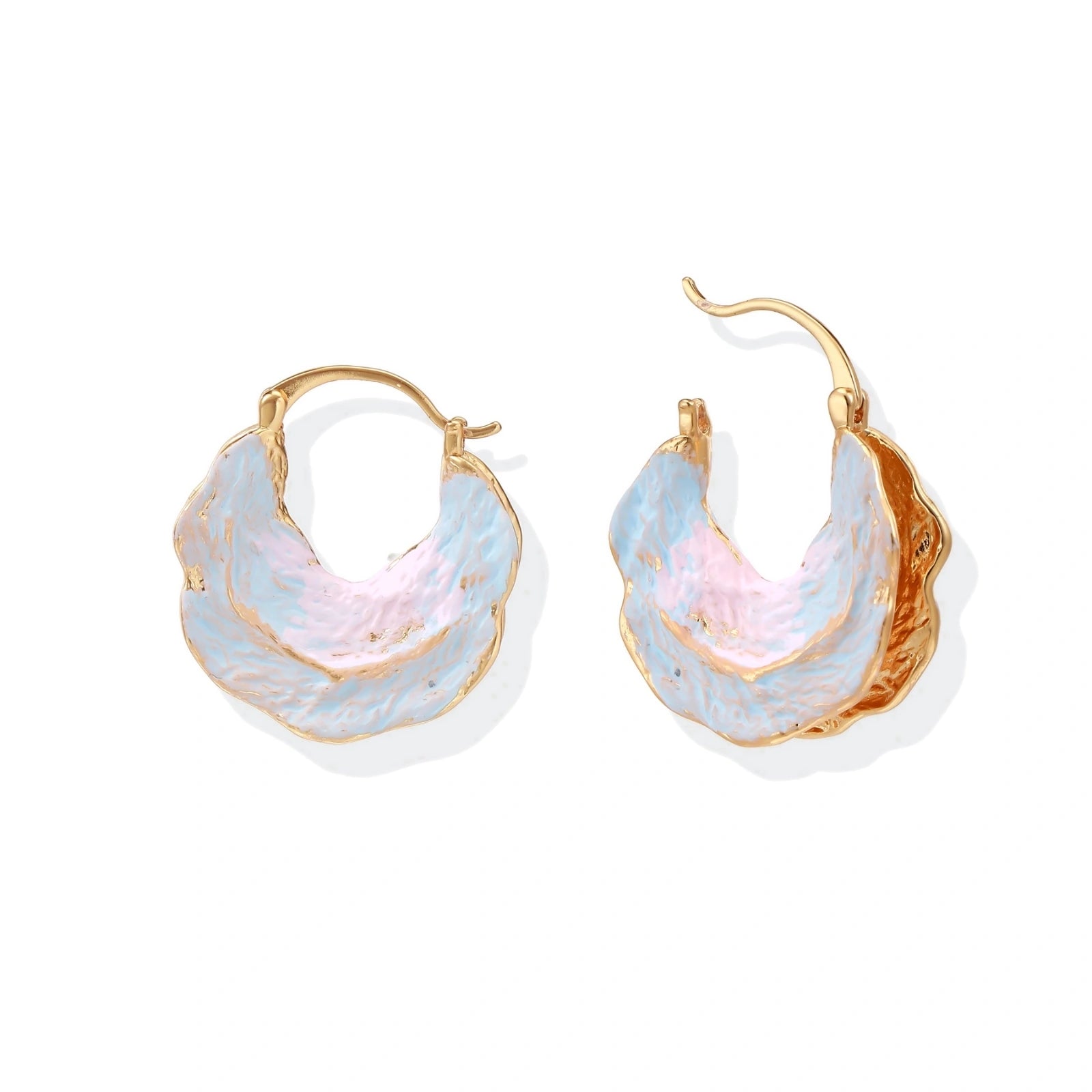 Shell-shaped hoop earrings with iridescent blue-pink enamel and gold trim on cream background