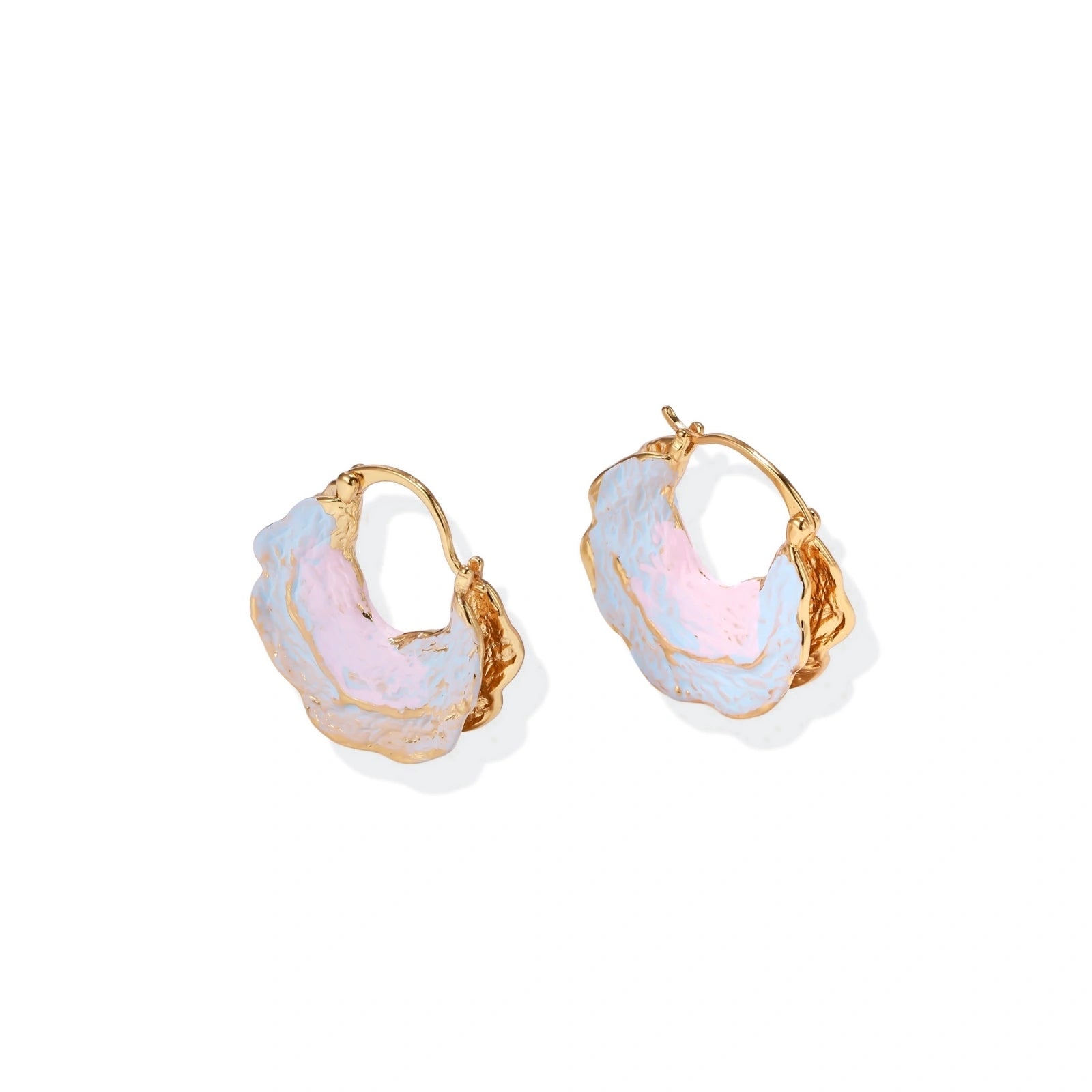 Shell-shaped hoop earrings with iridescent blue-pink enamel and gold trim on cream background