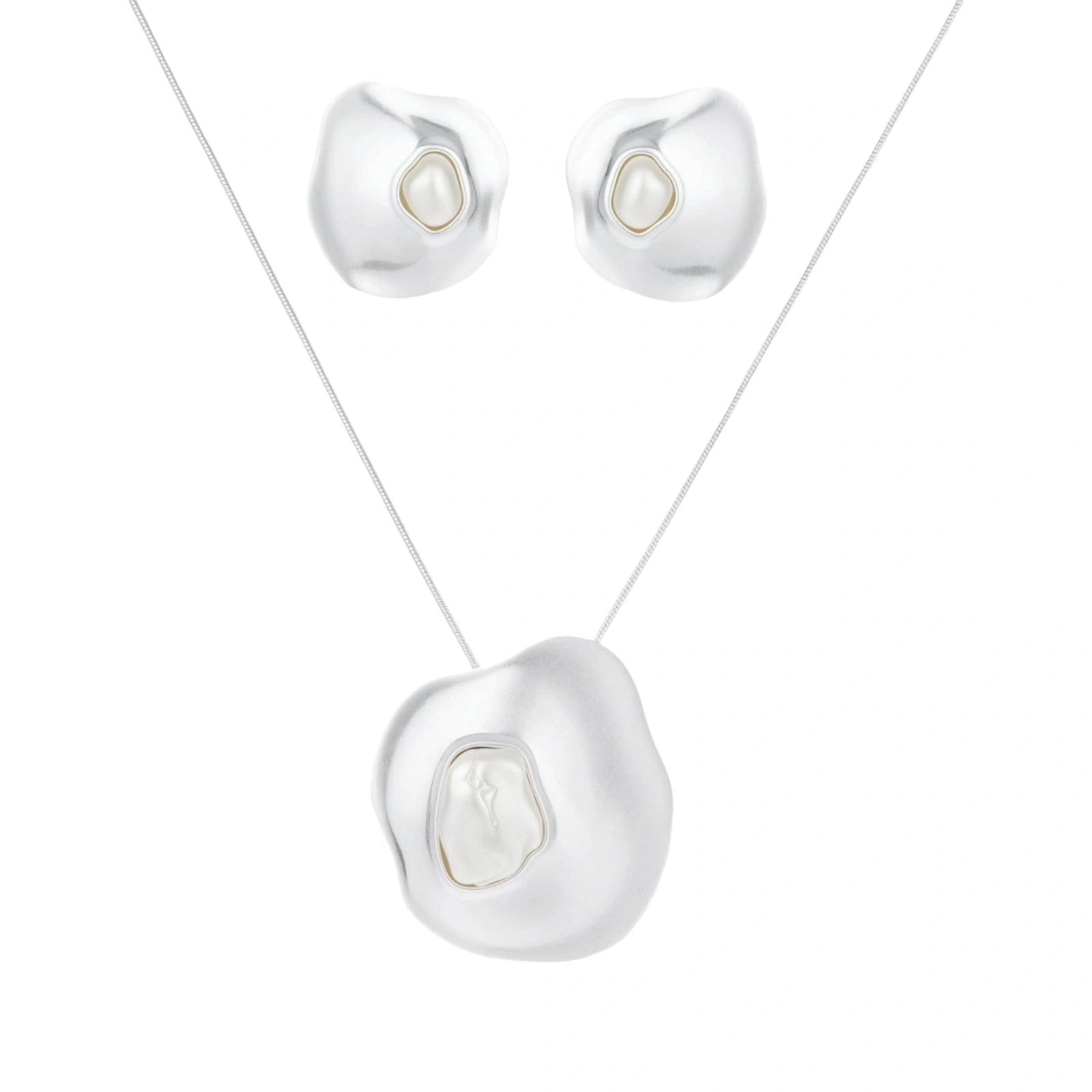 Organic curved earrings and necklace featuring baroque pearls in eco-zinc alloy settings on neutral background