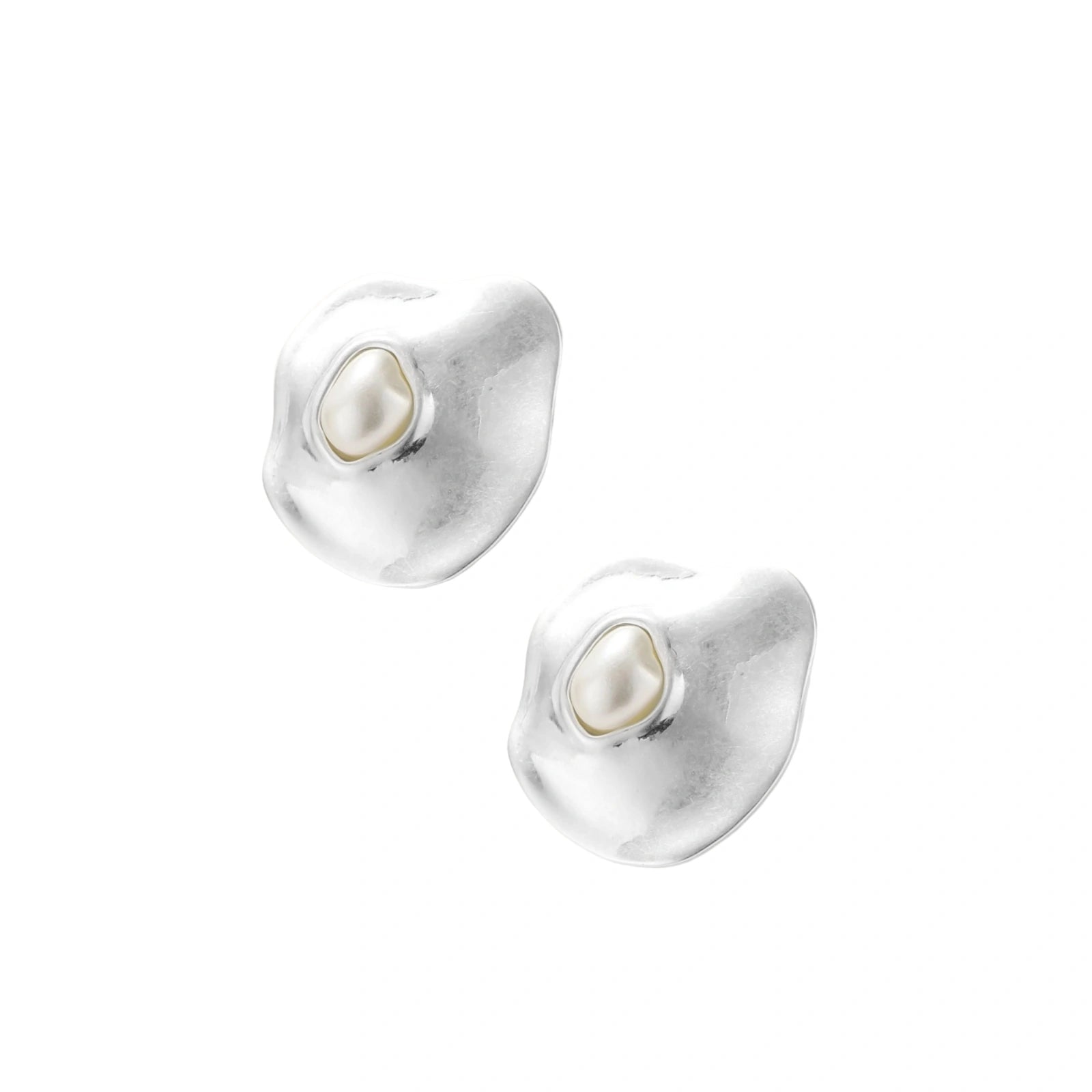 Organic curved earrings and necklace featuring baroque pearls in eco-zinc alloy settings on neutral background