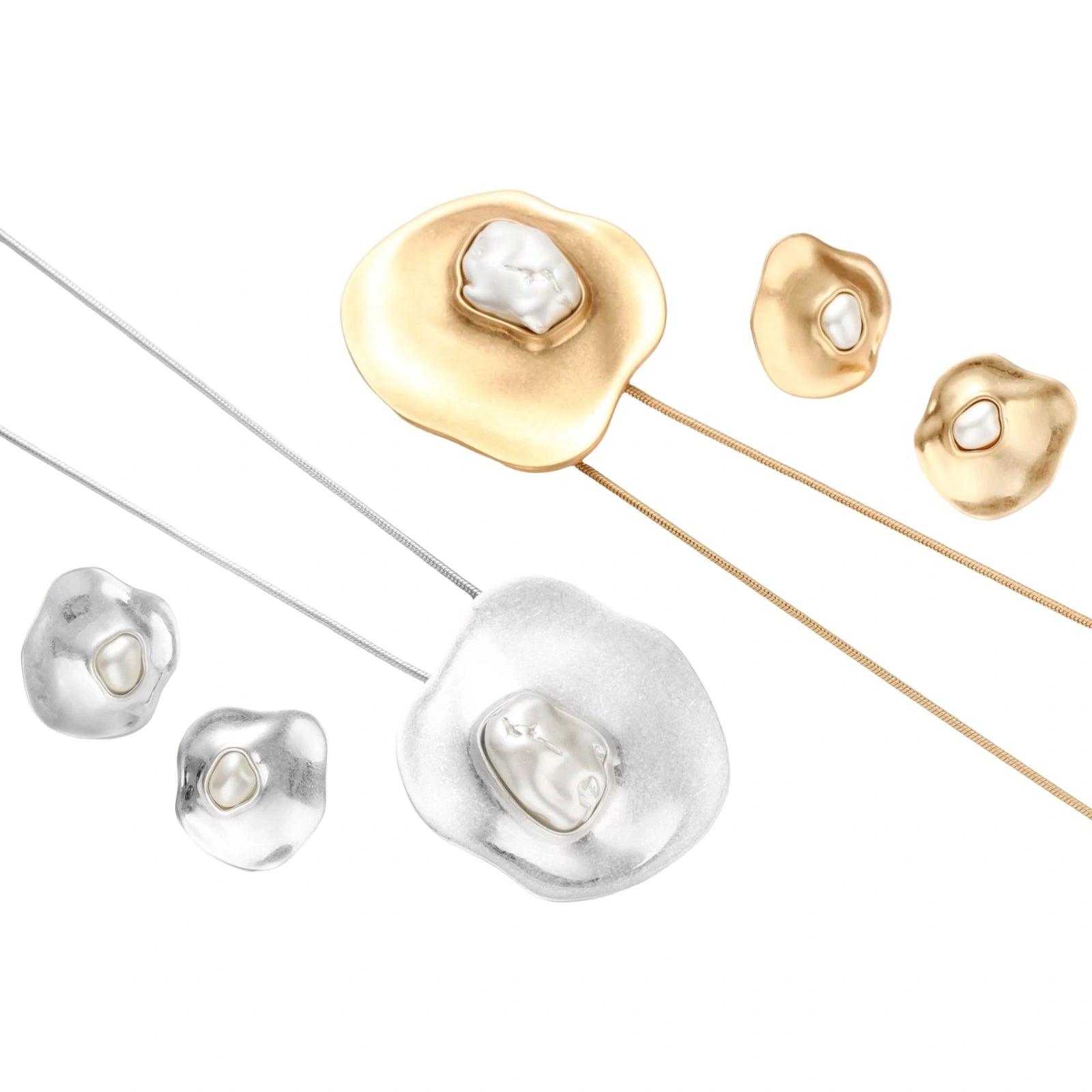 Organic curved earrings and necklace featuring baroque pearls in eco-zinc alloy settings on neutral background