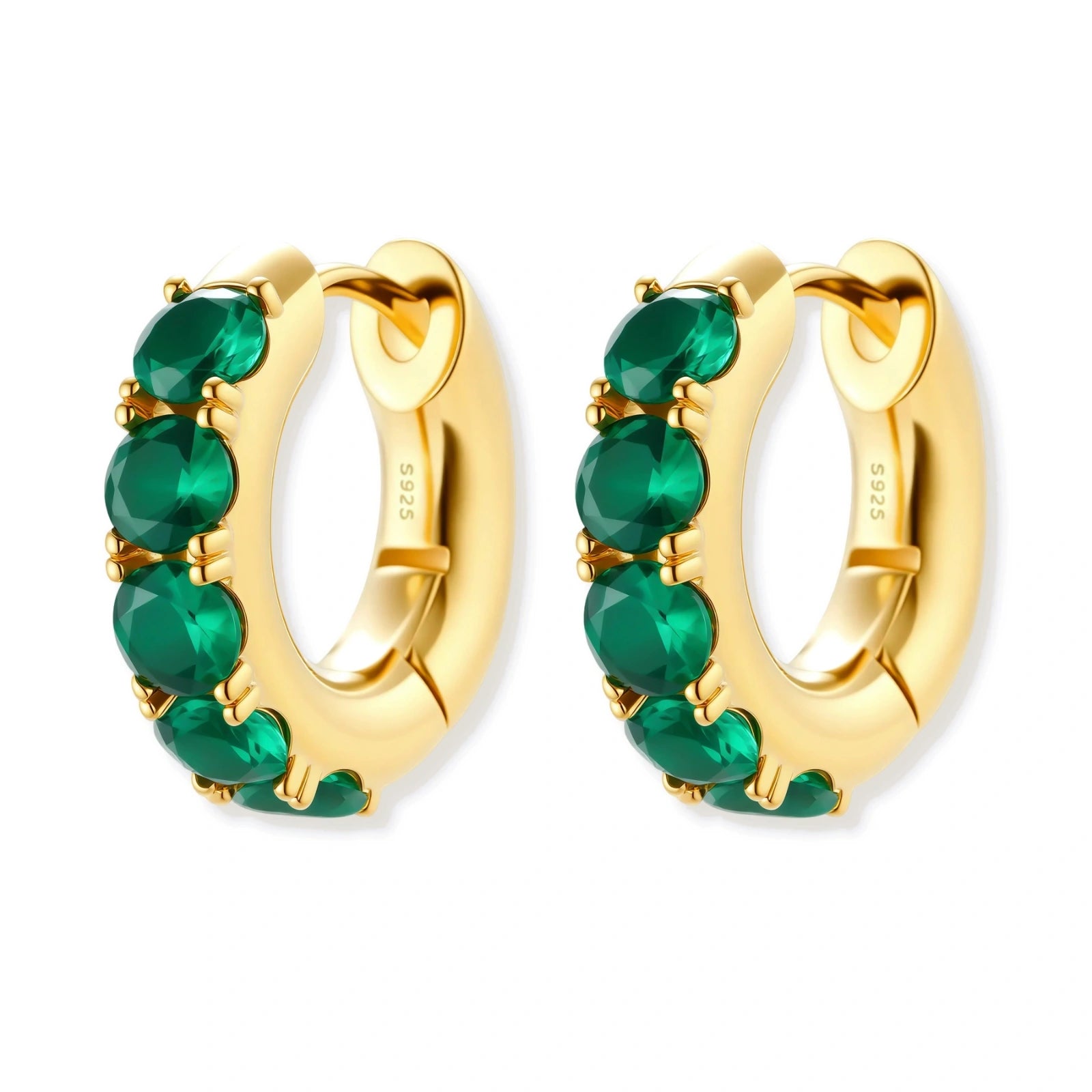 Close-up of gold-plated huggie hoop earrings featuring four emerald green cubic zirconia stones on white background.