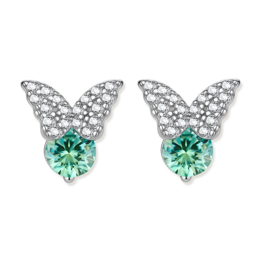 Sterling silver butterfly stud earrings with crystal wings and mint green center stones on cream background.