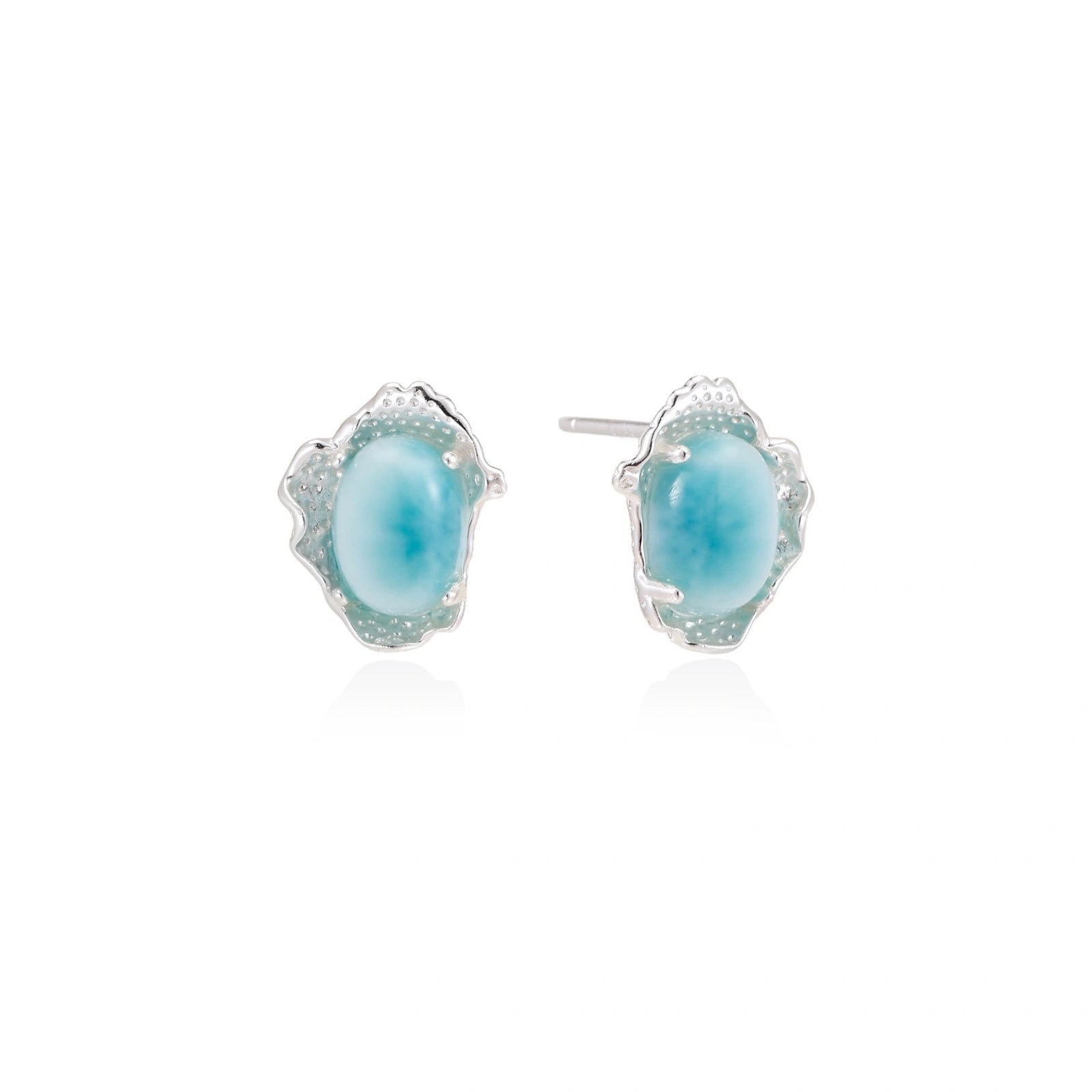 Oval larimar gemstone studs with ornate silver settings showing natural turquoise marbling on cream background