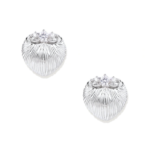 White gold-plated shell-textured stud earrings with three zirconia crystals on ridged surface against cream background.