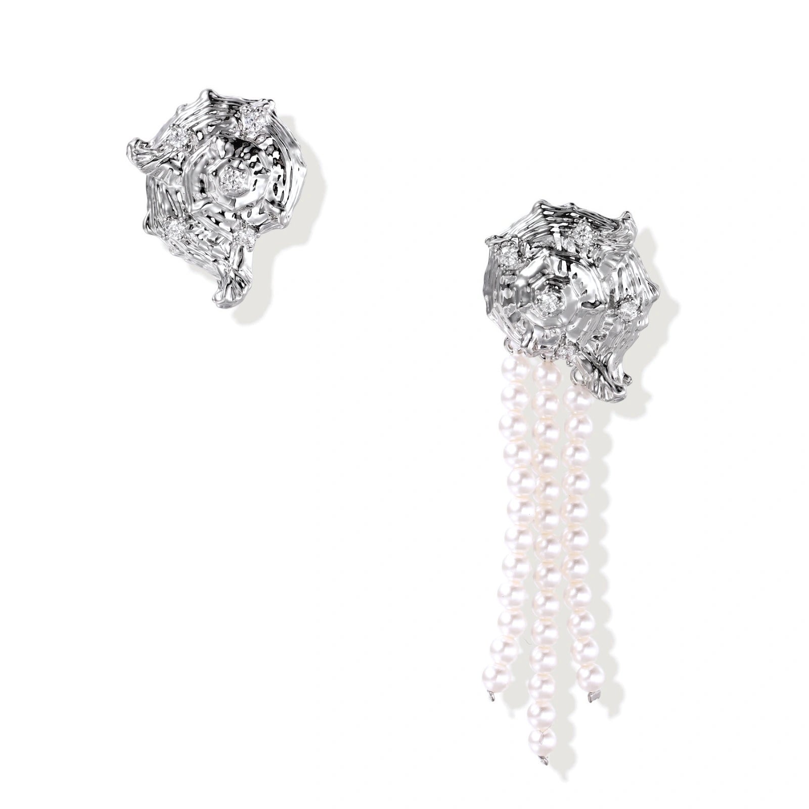 Silver-toned sculptural panther head earrings with zirconia details and white pearl drops on cream background