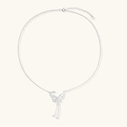 Sterling silver butterfly pendant with textured wing detail on adjustable Y-chain with ball drop ends