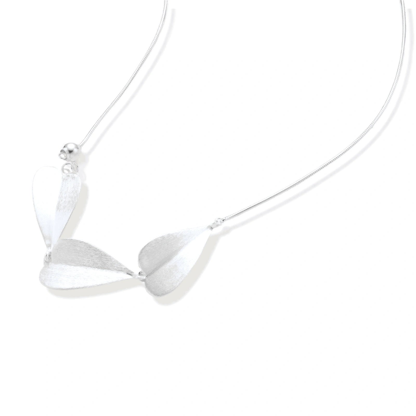 Minimalist sterling silver necklace with three brushed leaf-shaped pendants on delicate chain against white background