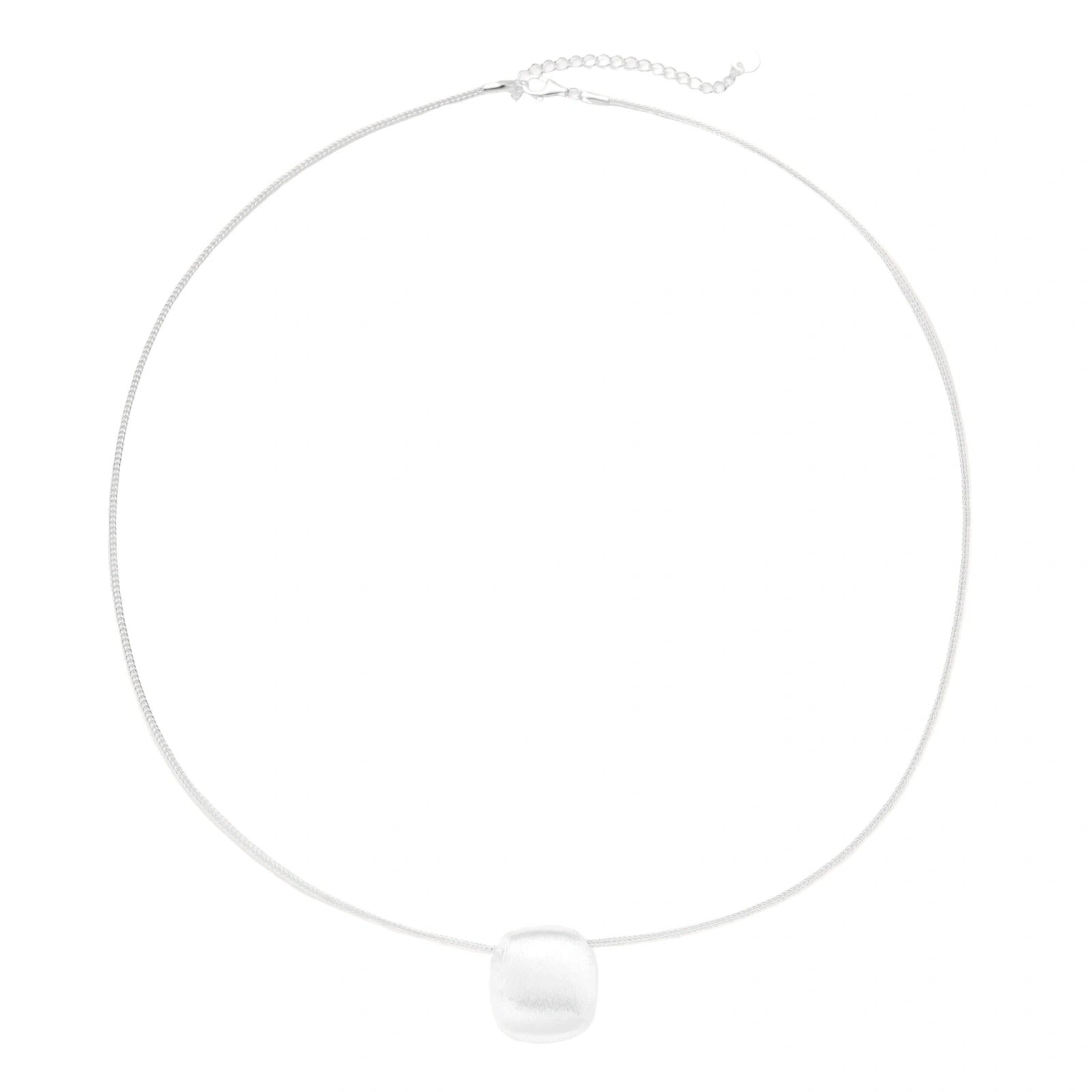 Minimalist brushed sterling silver dome pendant on delicate chain against cream background, showing matte textured finish