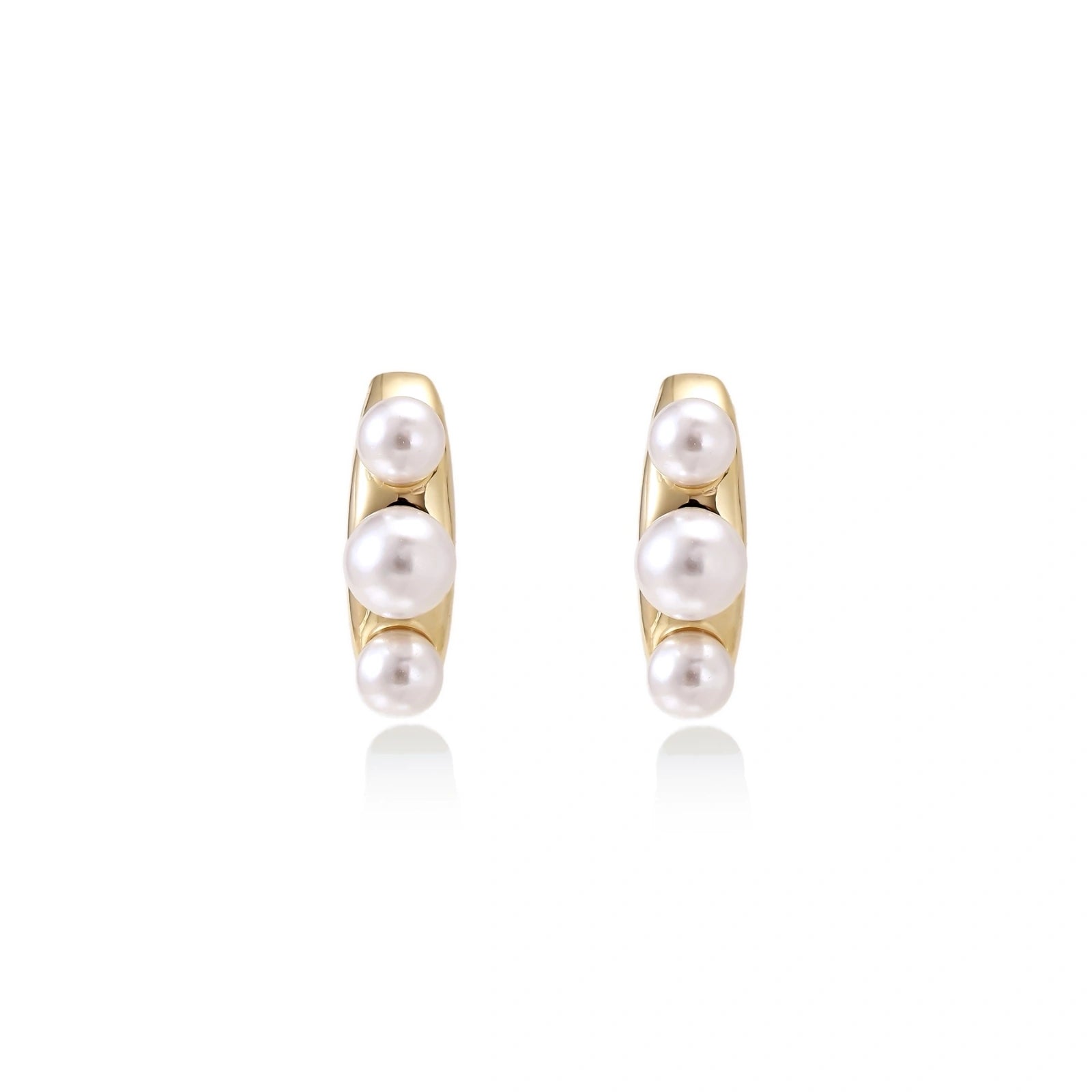 14K gold-plated curved stud earrings with three white freshwater pearls aligned vertically on cream background