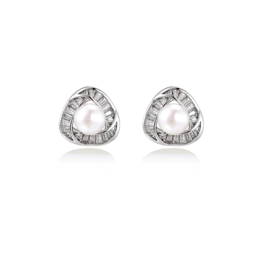 Triangular white gold plated stud earrings with central freshwater pearl and baguette-cut stones on white background