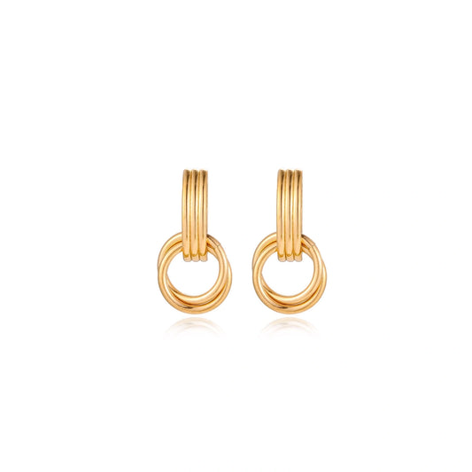 Gold stud earrings with vertical ridged bar connecting to triple interlocking circular rings on white background