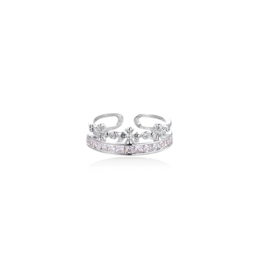 Silver-toned adjustable crown ring with channel-set square zirconia stones and delicate floral details on white background