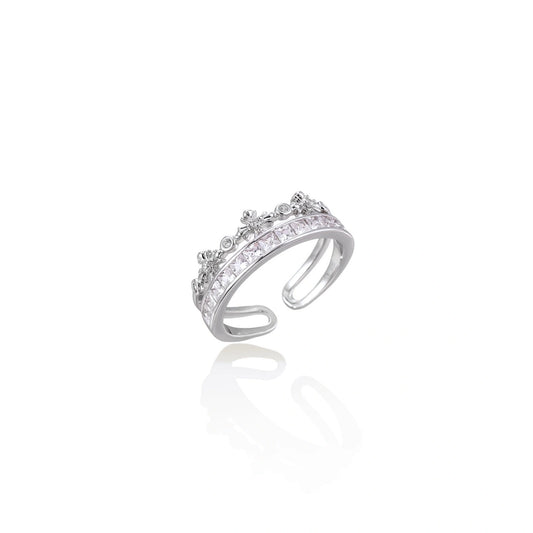 Silver-toned adjustable crown ring with channel-set square zirconia stones and delicate floral details on white background