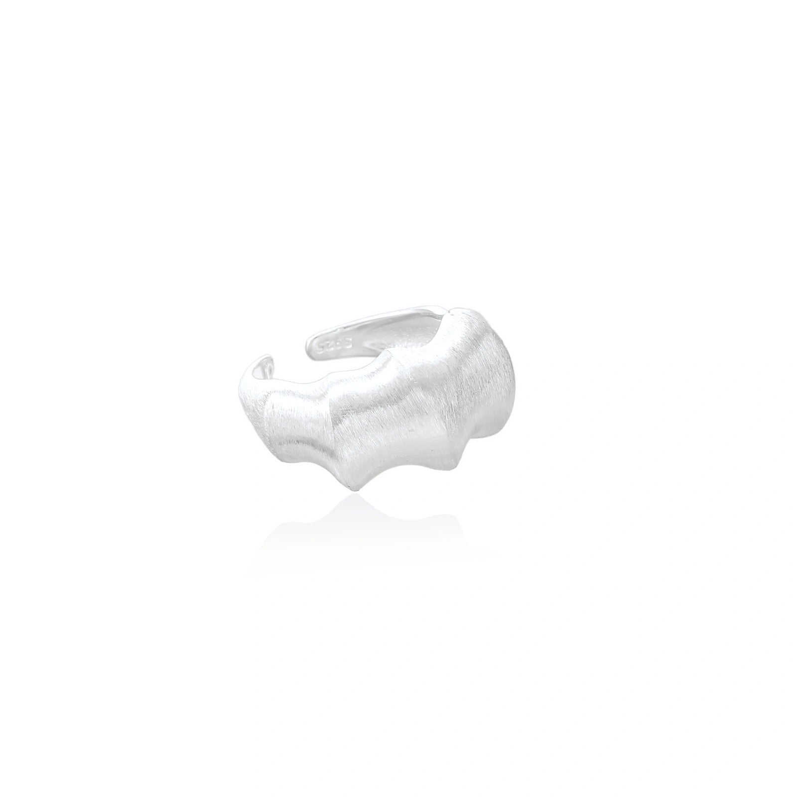 Brushed sterling silver ring with organic wave-like edges and adjustable cuff design on white background