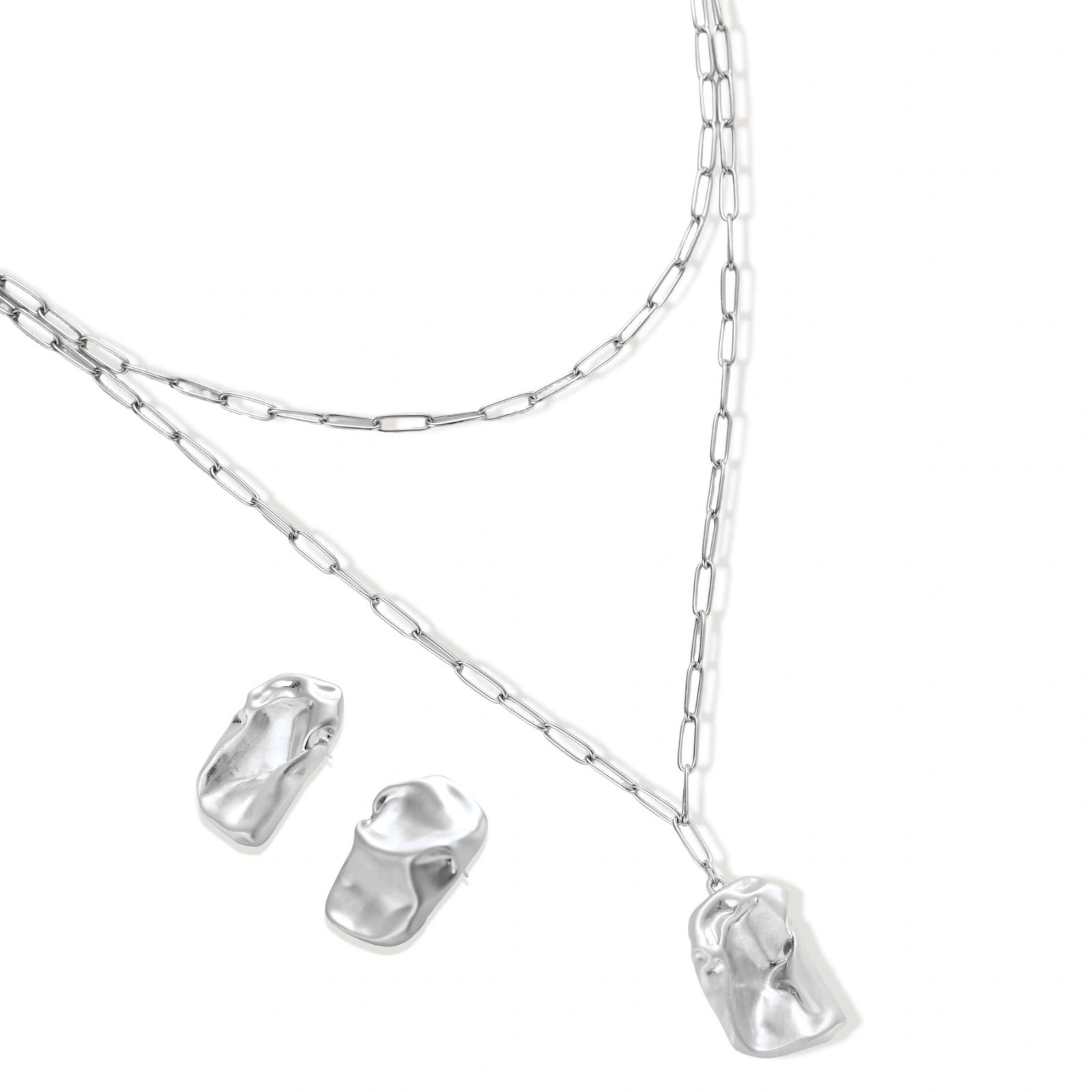 Modern textured hoop earrings and layered chain necklace with liquid metal pendant in silver and gold finishes.