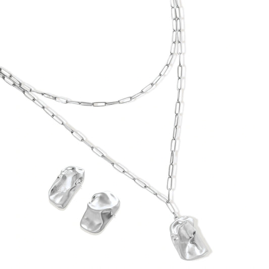Modern textured hoop earrings and layered chain necklace with liquid metal pendant in silver and gold finishes.