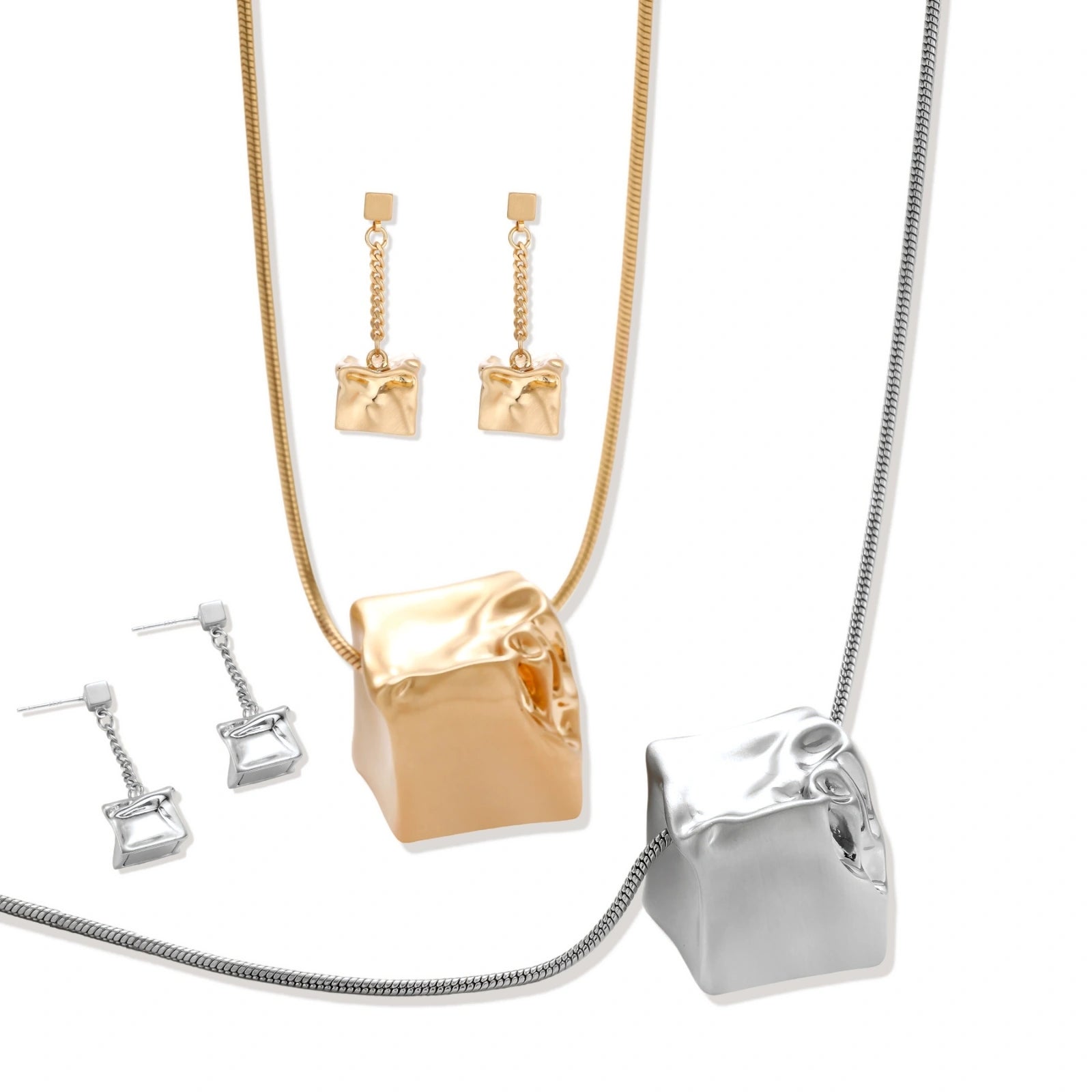 Geometric jewelry set with textured cube pendants on chains, featuring eco-zinc alloy in silver and gold finishes.