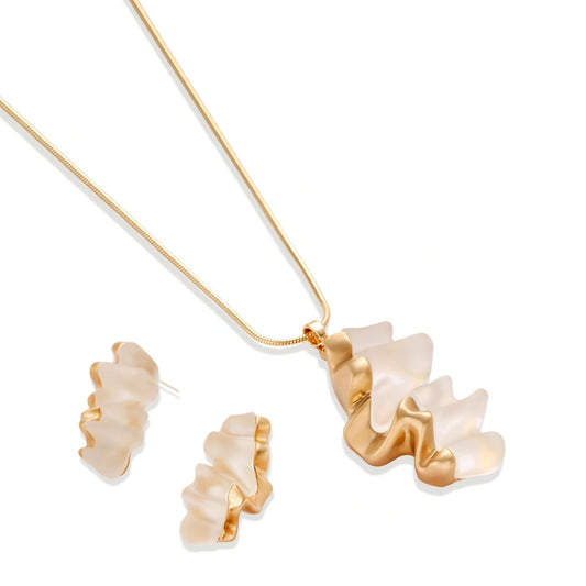 Sculptural gold-toned jewelry set featuring wavy organic earrings and matching necklace pendant with translucent resin accents.