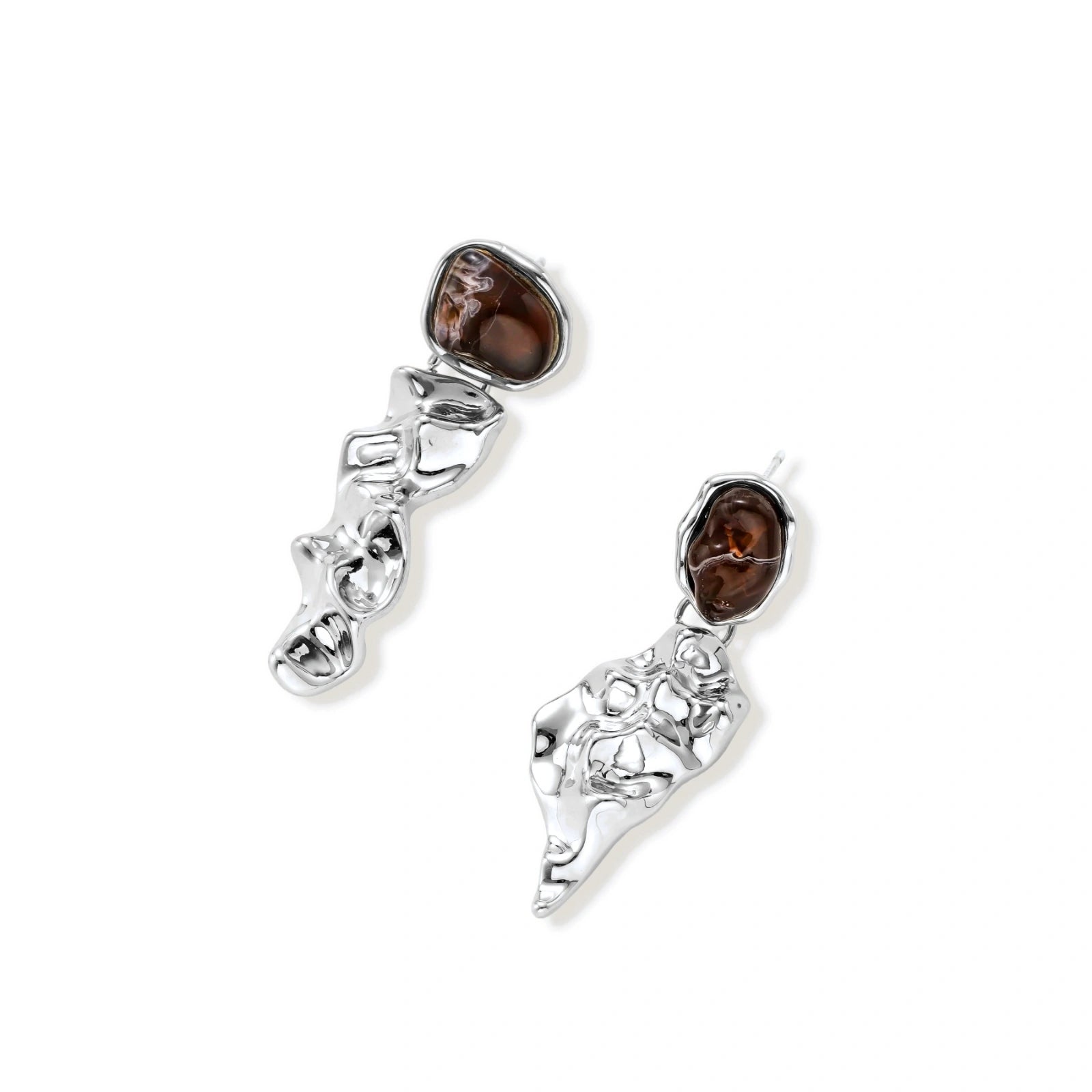 Abstract sculptural silver earrings with brown resin stones featuring organic fluid metalwork design on white background.