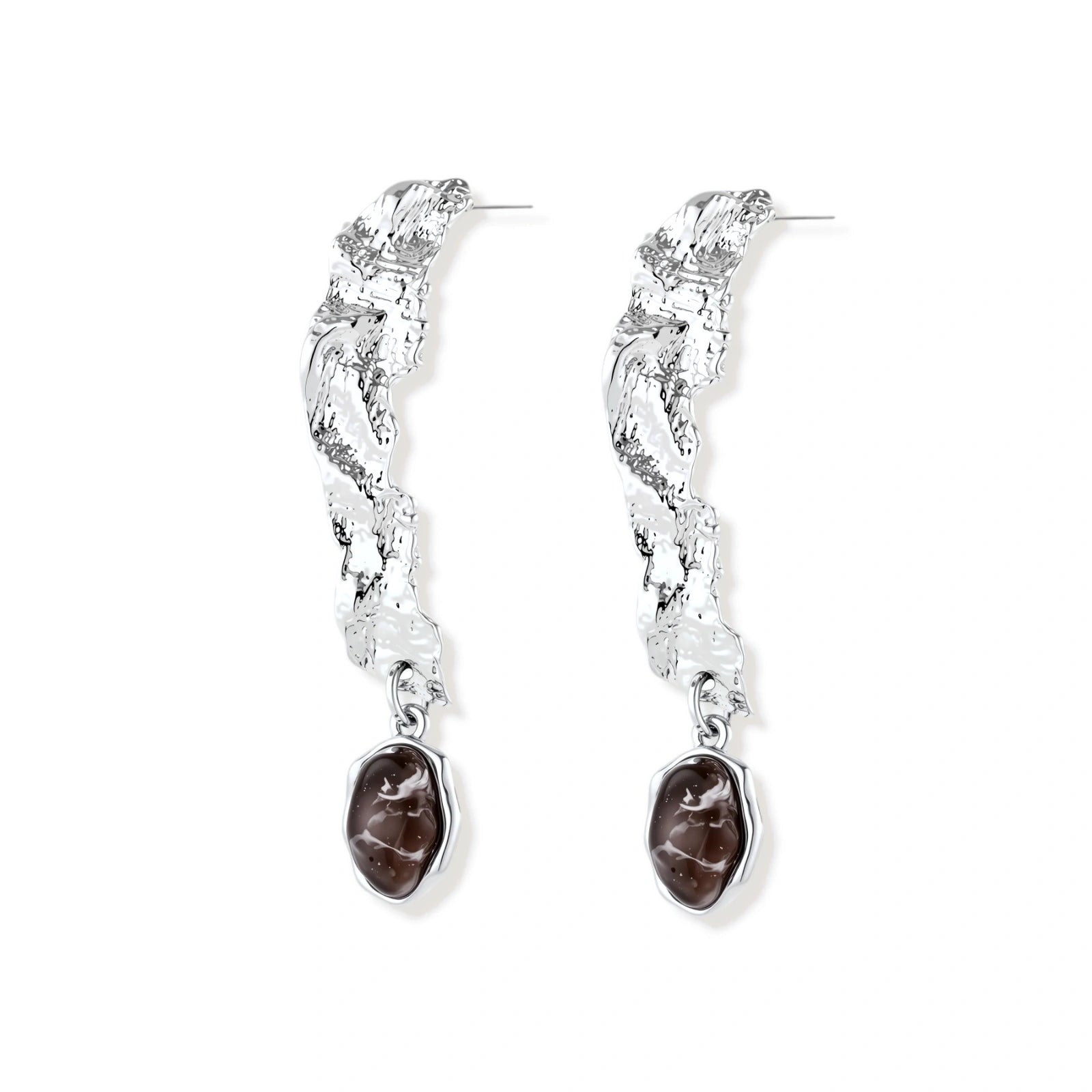 Silver-toned twisted metal earrings with dark brown oval resin stones dangling from sculptural posts on white background.