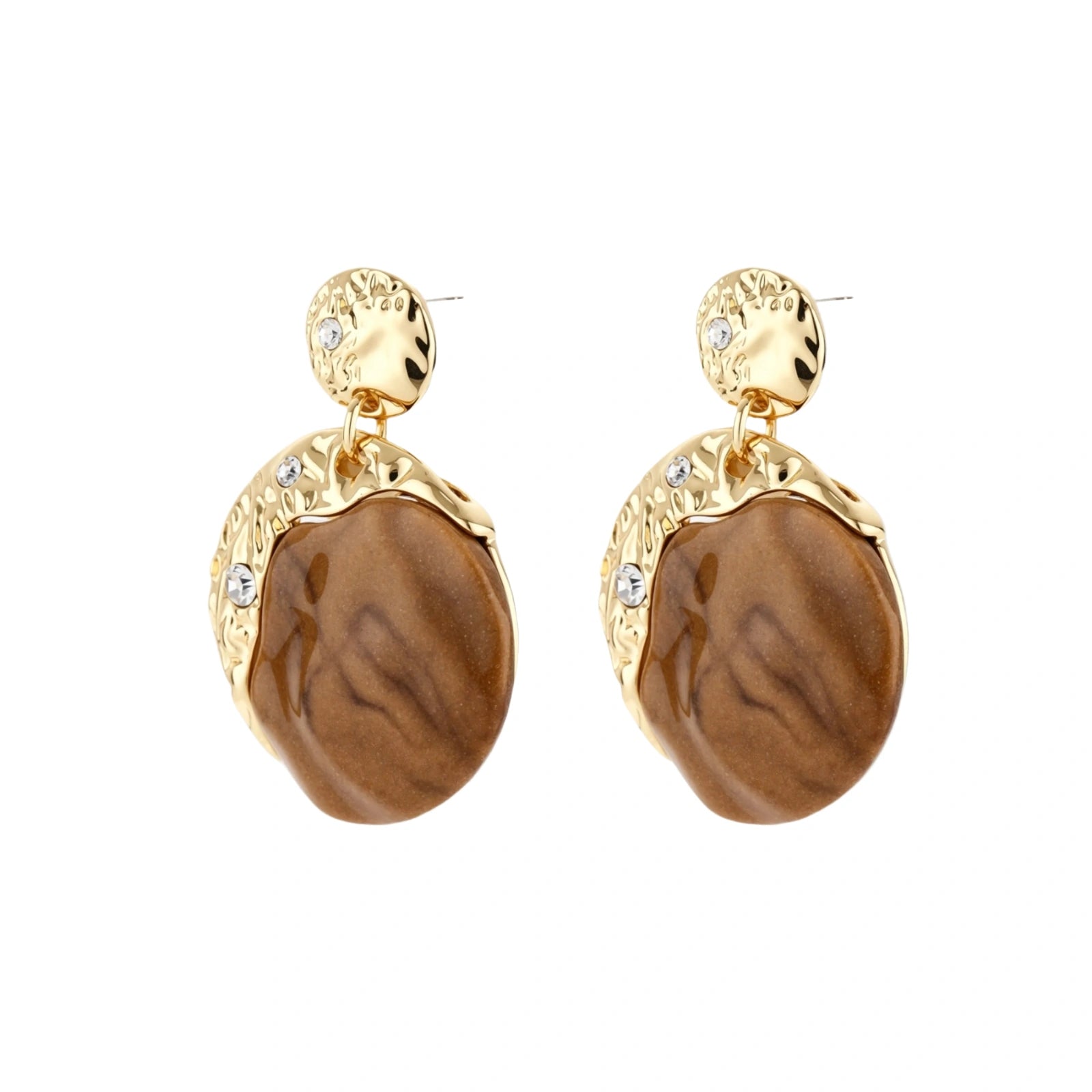 Gold-toned dangle earrings with organic brown resin stones and crystal accents on white background