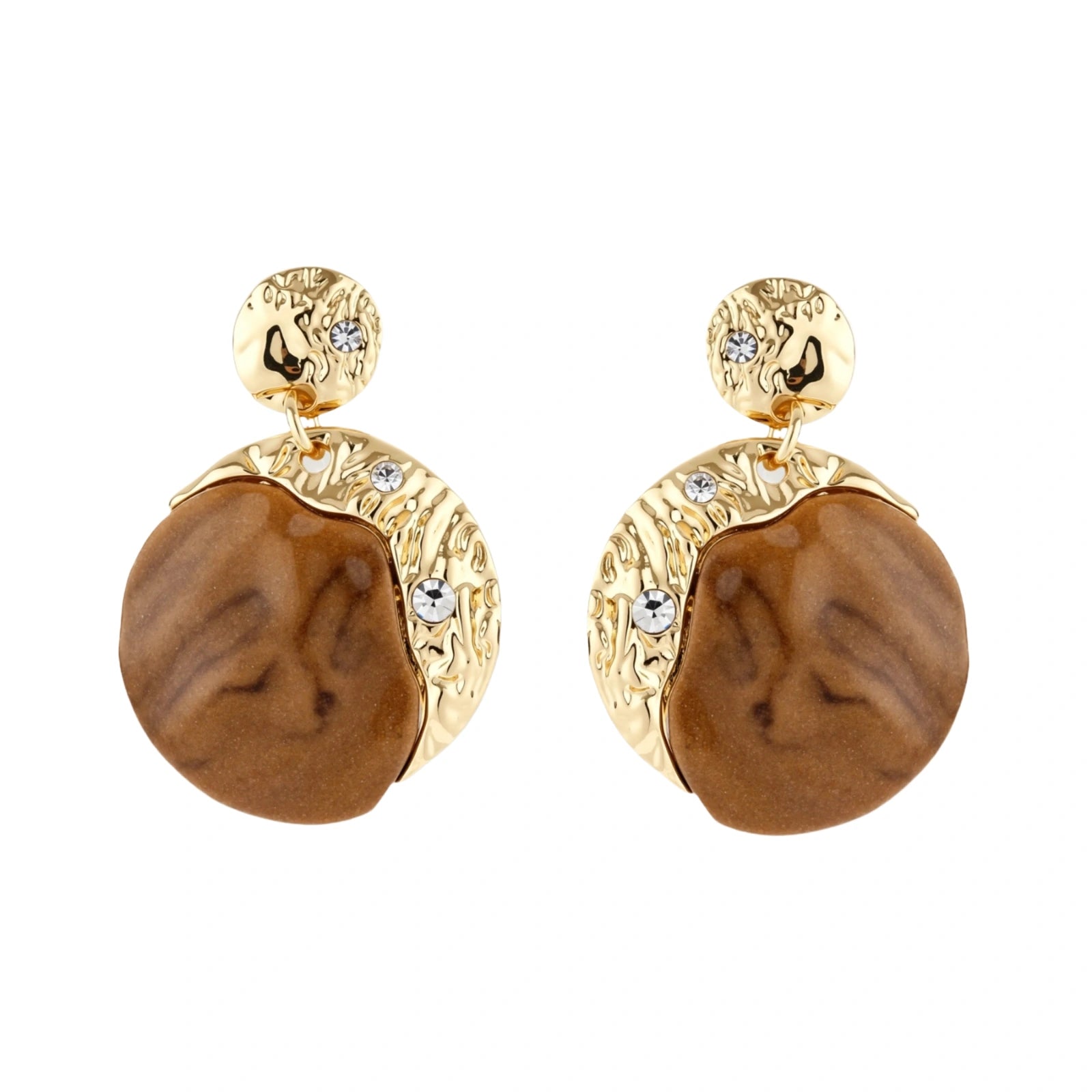 Gold-toned dangle earrings with organic brown resin stones and crystal accents on white background
