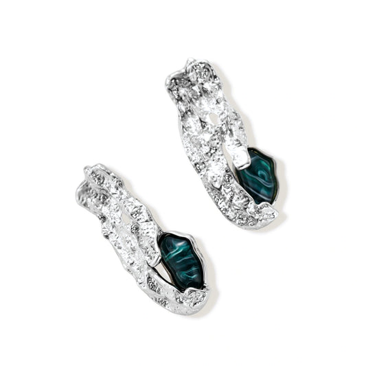Organic-shaped stud earrings with hammered silver finish and green malachite-pattern resin stones on white background.