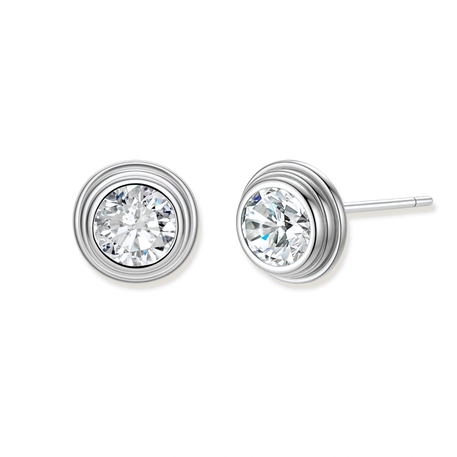 Close-up of sterling silver stud earrings featuring concentric circular frames with brilliant moissanite centers