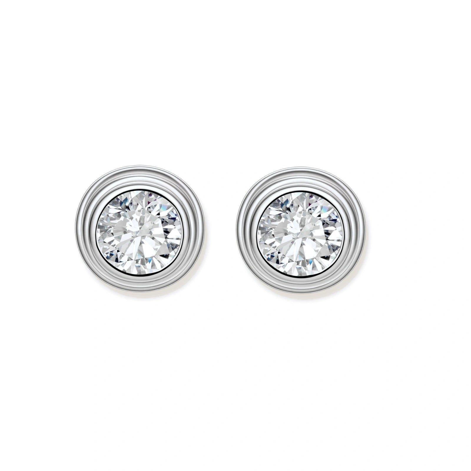 Close-up of sterling silver stud earrings featuring concentric circular frames with brilliant moissanite centers
