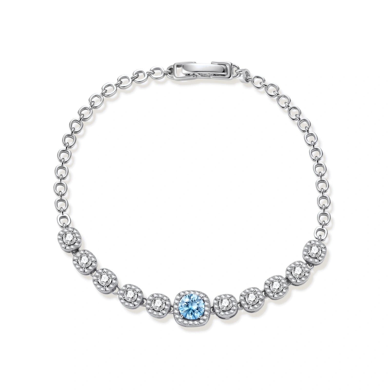 Sterling silver tennis bracelet with round halo-set moissanite stones and blue center stone on cream background.