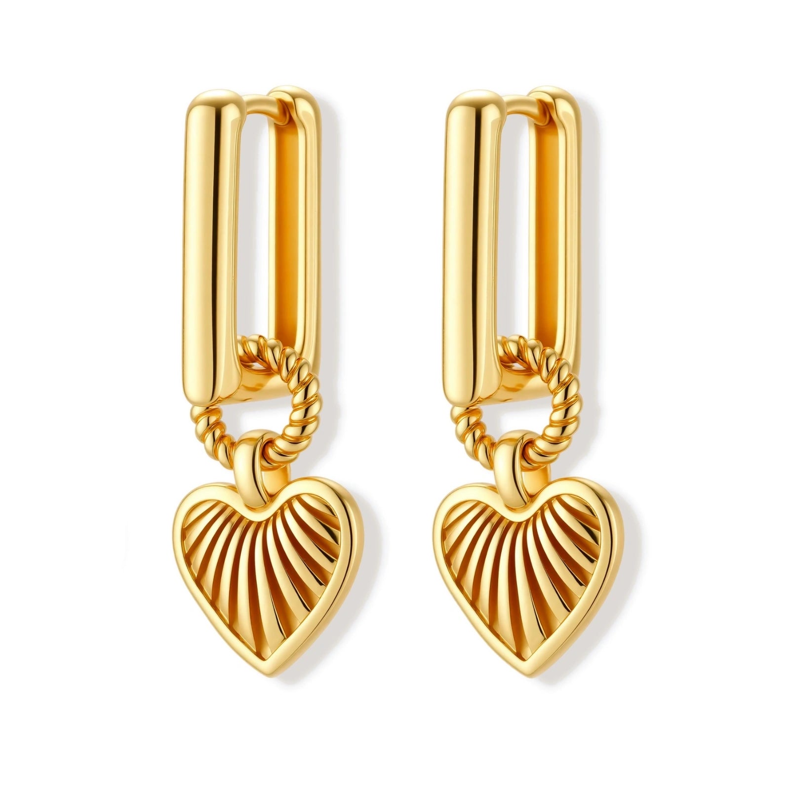 Gold-plated huggie earrings with textured heart charms featuring radiating sunburst patterns on white background.