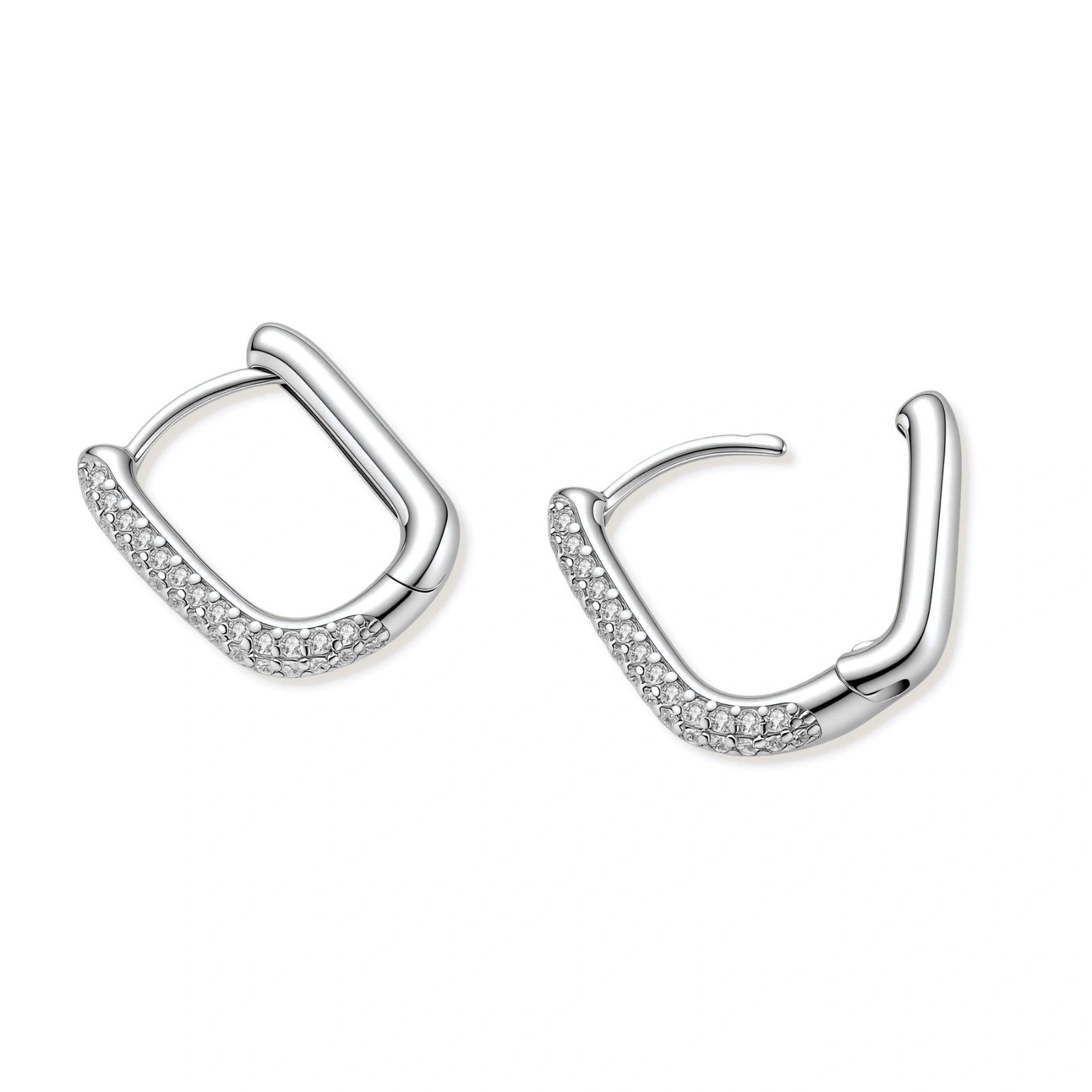 Close-up of platinum-plated sterling silver huggie hoops with pavé crystal setting on white background.