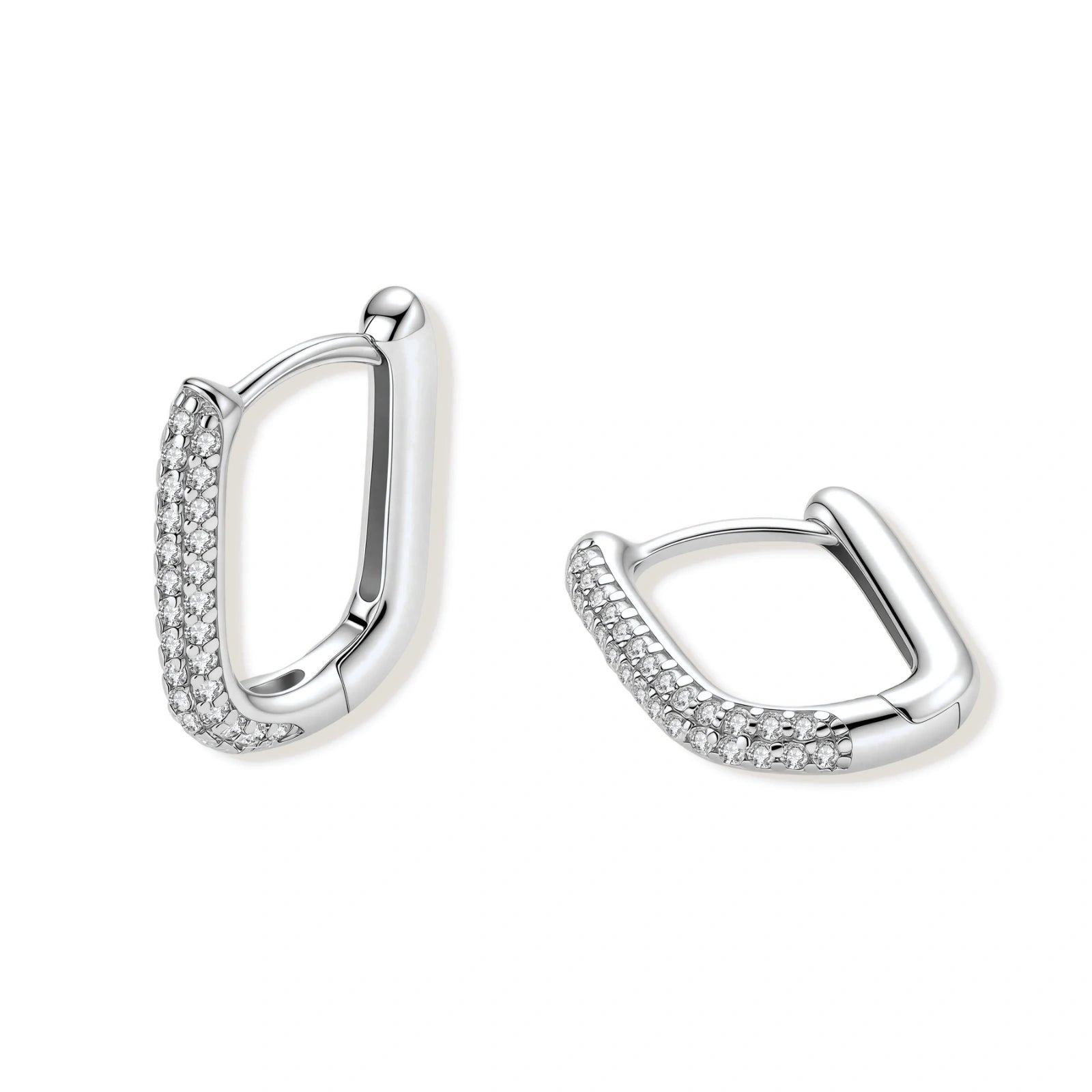 Close-up of platinum-plated sterling silver huggie hoops with pavé crystal setting on white background.