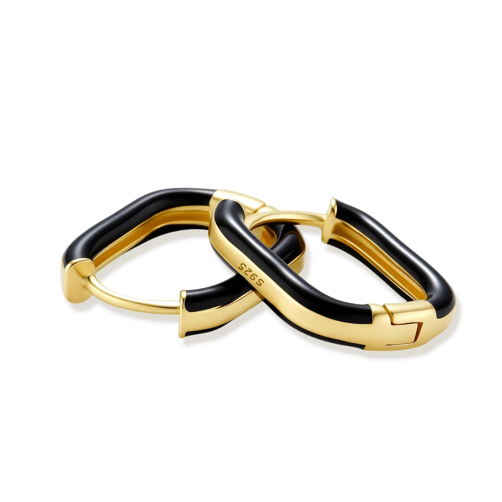 Modern hoop earrings with gold-plated and black sections, featuring hinged closure on white background.
